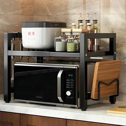 Étagère cuisine extensible SpaceRack™ noire sur un plan de travail.

Détail du réglage de la longueur de 40 à 60 cm de l'étagère.

Étagère SpaceRack™ supportant un micro-ondes et un grille-pain.

Plan de travail libéré et désencombré grâce à l'étagère extensible.

Structure en acier renforcé de l'étagère pour électroménagers lourds.

Mécanisme de réglage extensible de l'étagère de cuisine.

Design épuré de l'étagère SpaceRack™ dans une cuisine moderne.

Comparaison avant/après montrant le gain de place spec