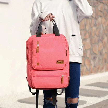 Sac à dos femme 25L en toile canvas – style urbain et fonctionnel avec multiples poches et compartiment pour ordinateur, parfait pour voyages courts et déplacements quotidiens.