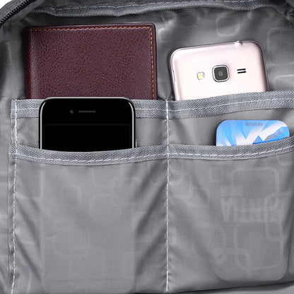 Sac à dos femme 25L en toile canvas – style urbain et fonctionnel avec multiples poches et compartiment pour ordinateur, parfait pour voyages courts et déplacements quotidiens.