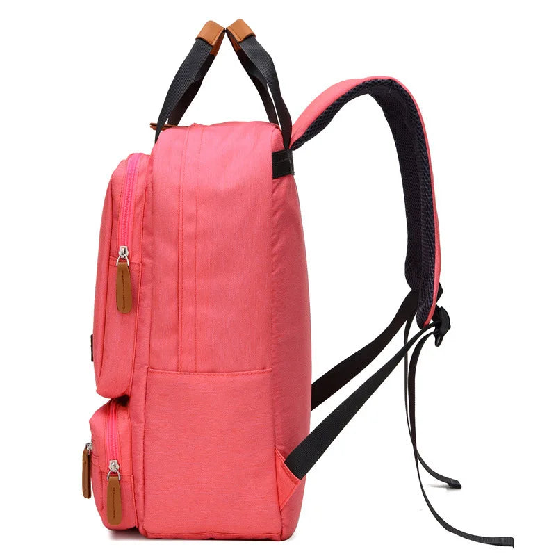 Sac à dos femme 25L en toile canvas – style urbain et fonctionnel avec multiples poches et compartiment pour ordinateur, parfait pour voyages courts et déplacements quotidiens.