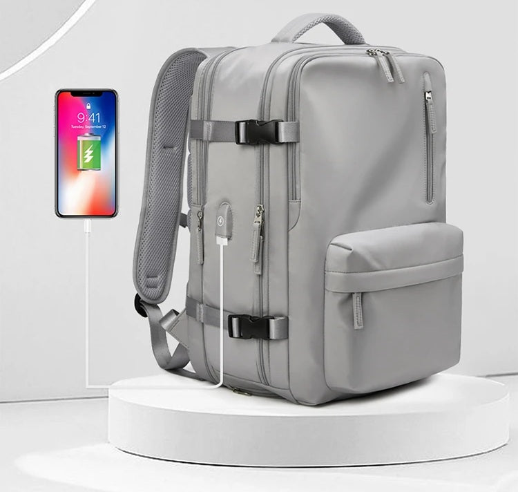 Sac de voyage à dos gris avec grande ouverture et compartiments organisés, sac à dos de voyage extensible pour avion, sac a dos chic